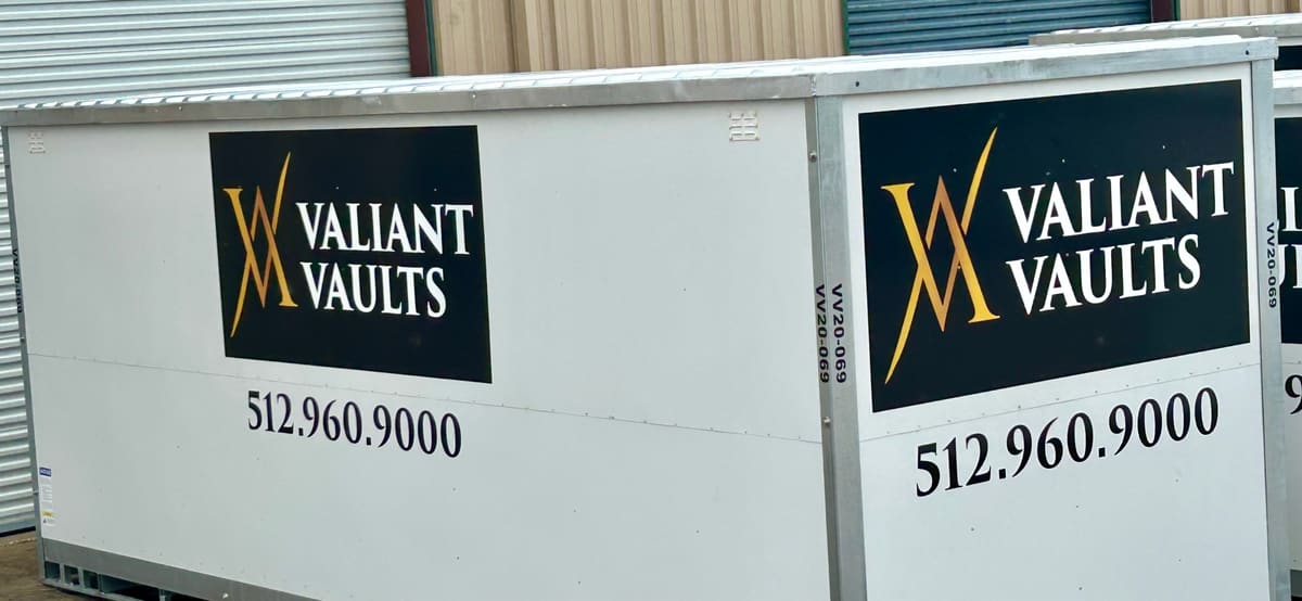 Valiant Vaults branded steel storage containers with the gold monogram logo